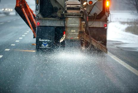Brine, a mixture of salt and water, is sprayed onto roads to prevent snow and ice from sticking or freezing to the pavement. Portland Press Herald Collection via Getty Images