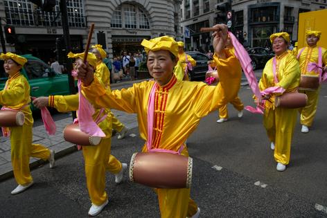 Falun Gong practitioners march in London, calling for an end to persecution by the Chinese Communist Party. James Willoughby/SOPA Images/LightRocket via Getty Images