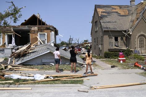 Residents inspect the damage amid debris and destroyed homes a day after a tornado ripped through Menasha, Wisconsin, on Tuesday, July 28, 2026. (Octavio Jones/AFP/Getty Images/TNS)