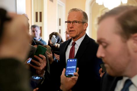 U.S. Senate Majority Leader John Thune (R-South Dakota) is followed by reporters as he walks to the Senate Chambers in the U.S. Capitol on Tuesday, Jan. 27, 2026, in Washington, D.C. (Anna Moneymaker/Getty Images/TNS)
