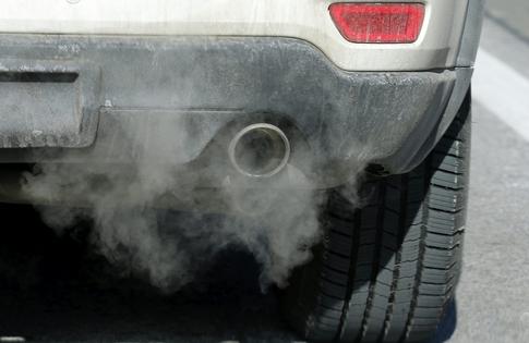 When a vehicle is stopped but the engine is running, it's still burning gas and emitting pollutants. AP Photo/Rick Bowmer