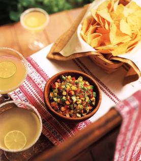 Carrots, sweet bell peppers, raw corn and diced avocado are added to the simple tomato salsa. (Maura McEvoy/TCA)