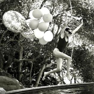 Bang Showbiz / Meghan, Duchess of Sussex, has marked her 45th birthday by sharing playful photographs of herself leaping into a swimming pool clutching balloons