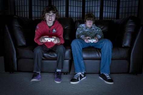 Boys playing video games. Dreamstime/TCA