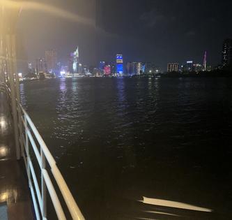 Ho Chi Minh City skyline at night from our riverboat. Andy Yemma