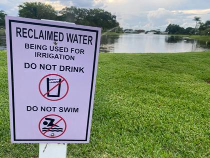 A sign warns passers-by that irrigation in the area uses treated sewage wastewater. Lindsey Nicholson/UCG/Universal Images Group via Getty Images
