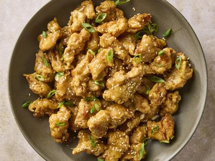 Who needs takeout when you can make extra-crispy double-fried chicken bites coated in a savory-sweet honey sauce right at home in under an hour? (Alex Lepe/TCA)