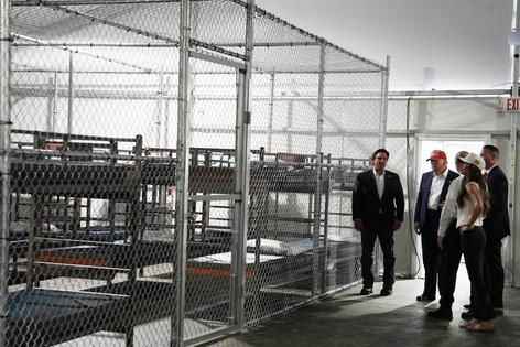 President Donald Trump, Florida Gov. Ron DeSantis and then-Homeland Security Secretary Kristi Noem tour Alligator Alcatraz, a migrant detention facility in Florida, in July 2025.
AP Photo/Evan Vucci