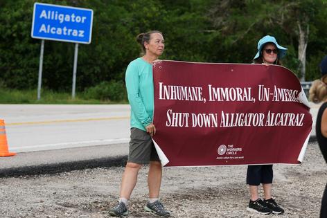 Protesters gather outside Florida’s ‘Alligator Alcatraz’ immigration detention center in May 2026.
              AP Photo/Lynne Sladky