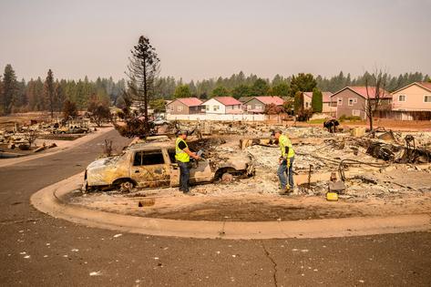 Smoke from burning buildings and vehicles, such as Spokane, Wash., experienced in August 2026, can carry harmful pollutants into neighboring homes. Josh Edelson/AFP via Getty Images