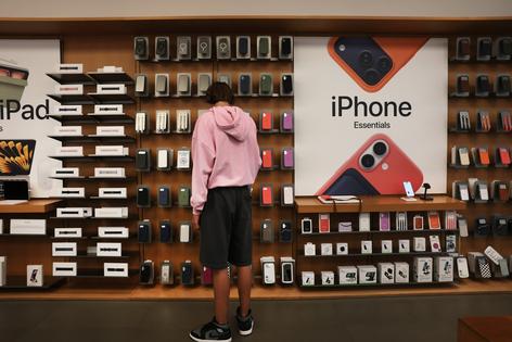 A shopper browses at an Apple store in lower Manhattan on July 30, 2026, in New York. (Spencer Platt/Getty Images/TNS)