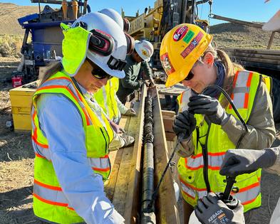 Study authors Regan Dunn and Ellen Currano work on a sediment core extracted from Wyoming’s Hanna Basin by colleagues with the U.S. Geological Survey. Cores like this capture layers of fossil pollen and leaf material going back in time, revealing how environments changed.
              Regan Dunn