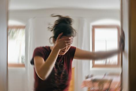 Woman experiencing dizziness. Dreamstime/TCA