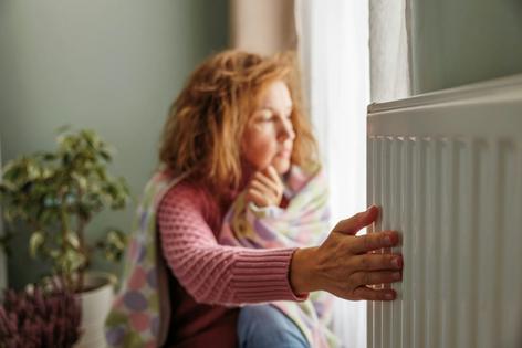 To keep energy bills manageable, people often set heating and cooling temperatures to uncomfortable levels. Olga Dobrovolska/Moment via Getty Images