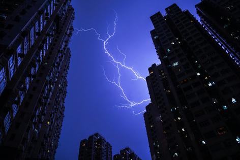 As lightning lights up apartment buildings, the thunder creates useful vibrations. Philip Fong/AFP via Getty Images