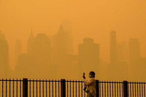 Wildfire smoke from Canadian fires has turned New York City's sky a hazy orange several times in recent years. Angela Weiss/AFP via Getty Images