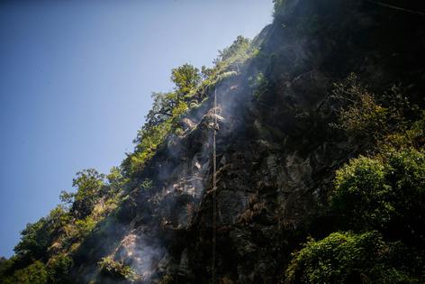 Honey hunters in Nepal scale incredible heights to harvest the honey of the Himalayan cliff bee. Skanda Gautam/SOPA Images/LightRocket via Getty Images