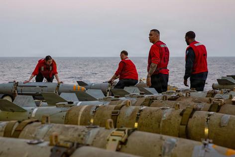 Navy sailors transfer ordnance onto an aircraft elevator on the USS Abraham Lincoln on Feb. 27, 2026.
U.S. Navy via AP