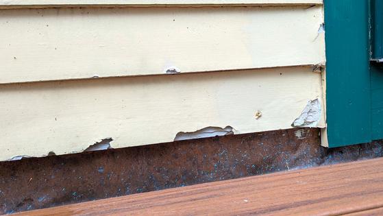 This ice-damaged fiber-cement siding will look like the one above once the gouges are filled with masonry epoxy that’s easy to use. (Tim Carter/Tribune Content Agency)