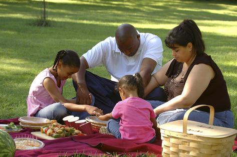 Family praying. Dreamstime/TCA