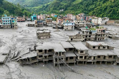 A massive rockfall in the Himalayas led to a surge of flood water than swept through villages, killing hundreds of people, on Aug. 26, 2026. Prabin Ranabhat/AFP via Getty Images 
