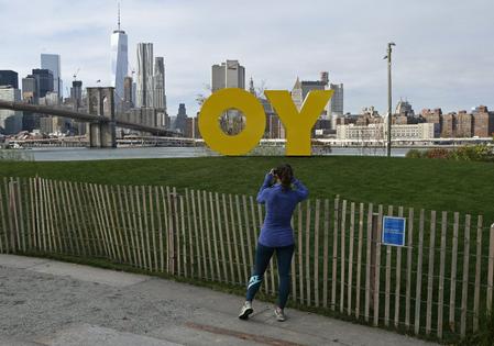 A sculpture by Deboray Kass that says 'Yo' from one side and the popular Yiddish expression 'Oy' from the other stood on display in Brooklyn Bridge Park in New York in 2015.  AP Photo/Kathy Willens