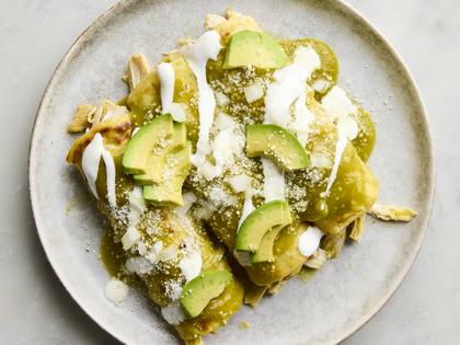 These green enchiladas are saucy and packed with tender chicken. (Ryan Liebe/TCA)