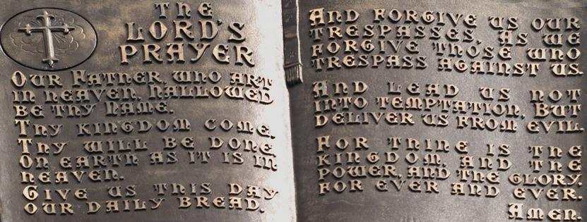 Close-up of the lord's prayer on a statue. Dreamstime/TCA