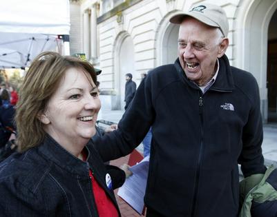 Wendell Berry, right, joins an 'I Love Mountains' rally against mountaintop mining at the Kentucky Capitol in 2013.  AP Photo/James Crisp