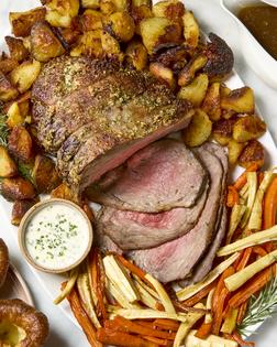 Make a traditional Sunday roast with rosemary roasted beef, carrots and parsnips, crispy potatoes, creamy horseradish sauce, and warm gravy. (Alex Lepe/TCA)