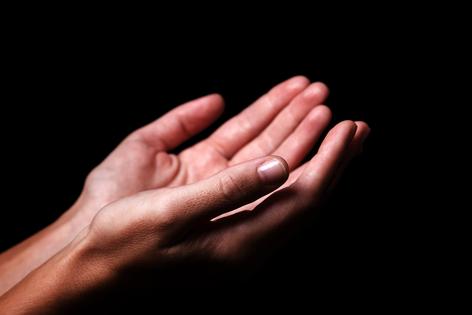 Praying hands. Dreamstime/TCA
