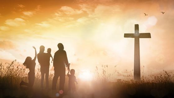 Christian family worship. Dreamstime/TCA