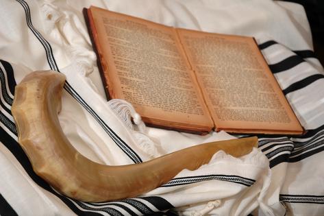 Shofar, Hebrew book and tallit. Icons of Rosh Hashana, the Jewish new year. Dreamstime/TCA
