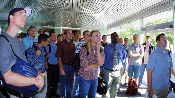 Students at the Brigham Young University business school watch television reports of the terrorist attacks in New York and Washington on Sept. 11, 2001.
George Frey/AFP via Getty Images