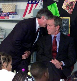 President George W. Bush reacts in a Sarasota, Fla., classroom after being told of the terrorist attacks in New York and Washington on Sept. 11, 2001. AP Photo/Doug Mills