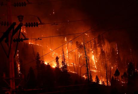 More people living in the wildland urban interface creates more potential ignition sources, like power lines.
Robyn Beck/AFP via Getty Images