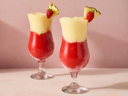 This frozen cocktail layers creamy coconut and pineapple with sweet strawberry for a refreshing, frosty drink. (Erik Bernstein/TCA) FILENAME:
