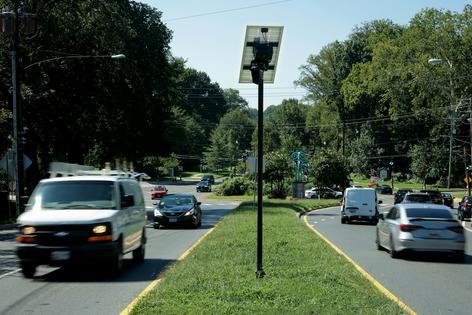 Traffic flows past an Axon brand automatic license plate reader camera in the median of 16th Street near the border of Maryland and the District of Columbia on Aug. 19, 2026, in Silver Spring, Maryland.
              Chip Somodevilla/Getty Images
