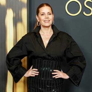 Bang Showbiz / Amy Adams has to tame her 'golden retriever' personality on set