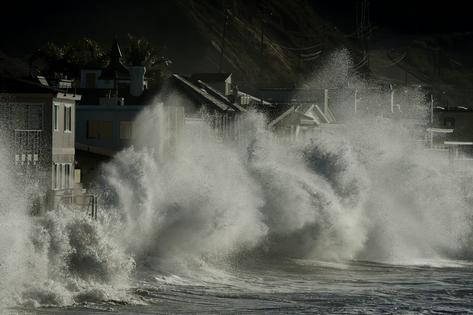Storm waves crash onto seaside houses at Mondos Beach, Calif., on Jan. 12, 2016, during a strong El Niño.
Mark Ralston/AFP via Getty Images