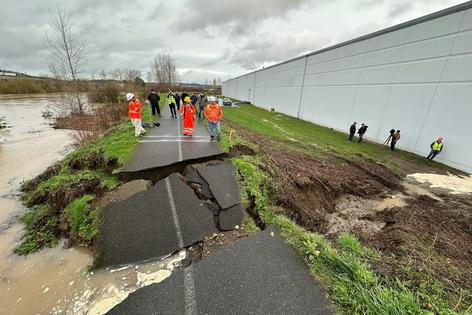 Crews inspect damage to a Green River levee in the Seattle suburbs on Dec. 15, 2025. Thousands of people were urged to evacuate during a series of atmospheric river storms, and the National Guard was sent to monitor and reinforce several levees considered at risk.
AP Photo/Manuel Valdes