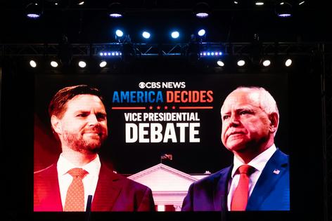 Note the red-blue shading in the CBS News broadcast of the vice presidential debate between U.S. Senator and GOP candidate JD Vance and Minnesota Governor and Democratic candidate Tim Walz on Oct. 1, 2024.
              Nathan Morris/NurPhoto via Getty Images
