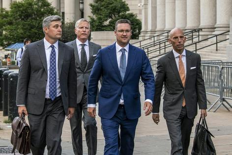 Trump pardoned Nikola Corp. founder and former Executive Chairman Trevor Milton, center, in March 2025.
              AP Photo/Brittainy Newman