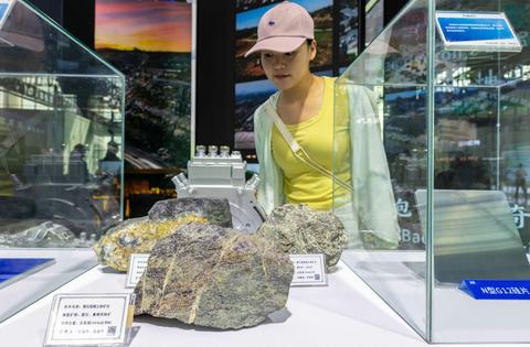 A visitor stops by a rare earth iron ore exhibit during the 5th China-Mongolia Expo on Aug. 26, 2025, in Hohhot, China.
Ding Genhou/VCG via Getty Images