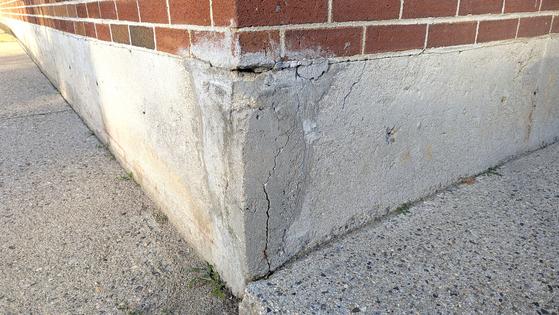 The person who tried to patch this concrete foundation either didn't care or didn't bother to research how to achieve professional results. (Tim Carter/Tribune Content Agency/TNS)