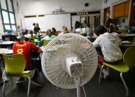 Many older school buildings lack air conditioning, leaving fans as the main defense against classroom heat. RJ Sangosti/MediaNews Group/The Denver Post via Getty Images