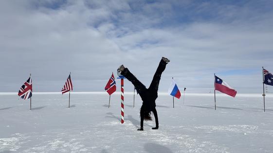 This is the right way up: Abigail Bishop does a handstand at the ceremonial South Pole.
Abigail Bishop