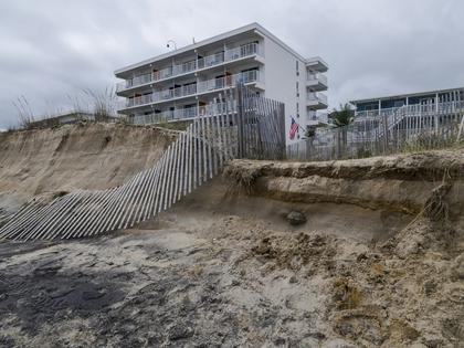 Fences and sand dunes lie in ruin along Maryland’s Ocean City Beach on Sept. 28, 2026.
              Finn Gomez/Getty Images