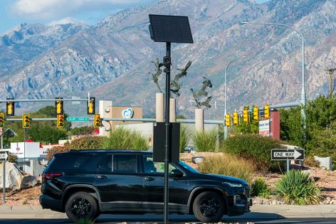 A solar-powered Flock surveillance camera monitors vehicle traffic in American Fork, Utah, on Sept. 20, 2026.
              Charles-McClintock Wilson/NurPhoto via Getty Images