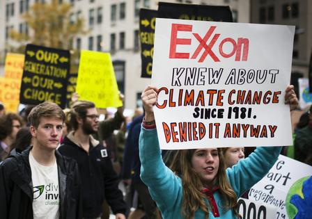 Protestors have argued for years that fossil fuel companies knew about the climate damage their products were causing.
              Johnny Silvercloud via Wikimedia Commons, CC BY-SA